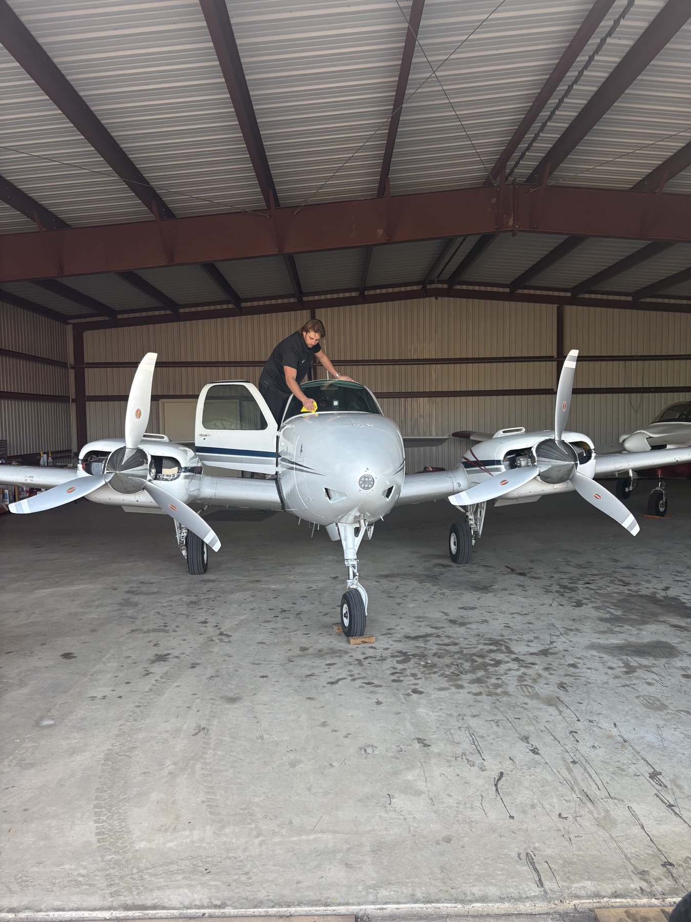 Aircraft windshield detailing in Central Texas hangar