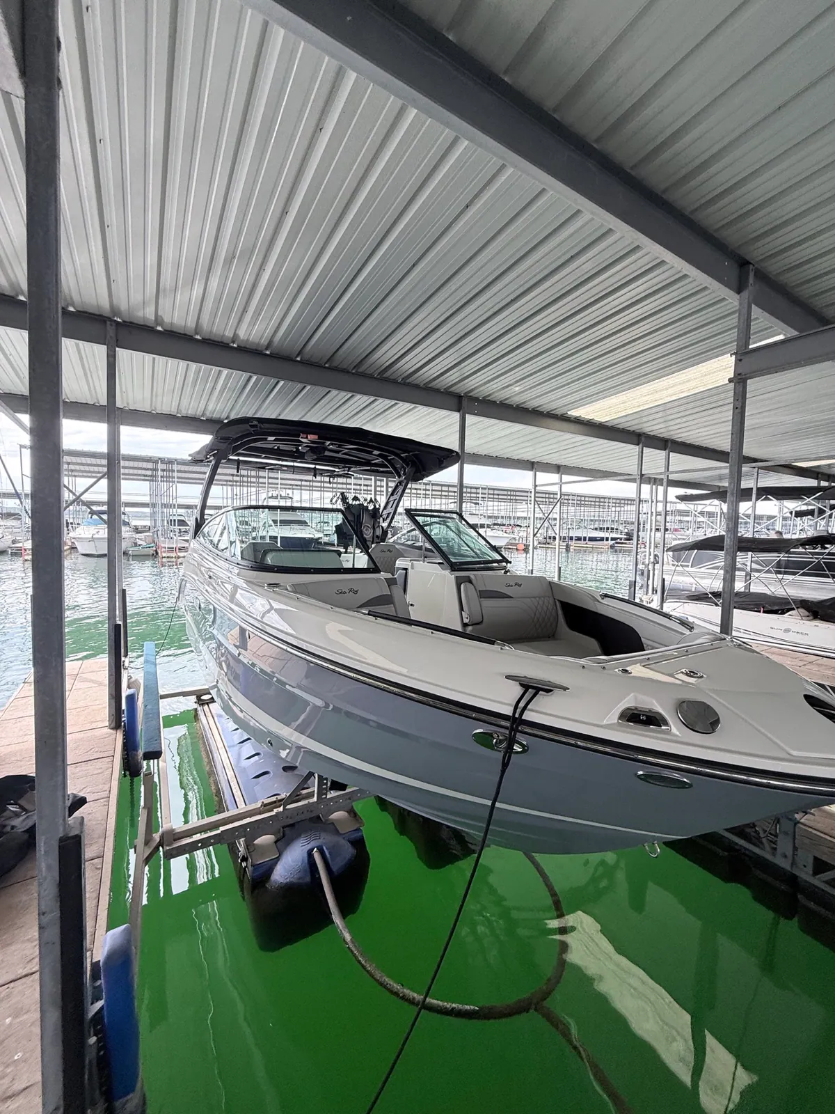 Sea Ray at a covered marina during a Spade detailing appointment.
