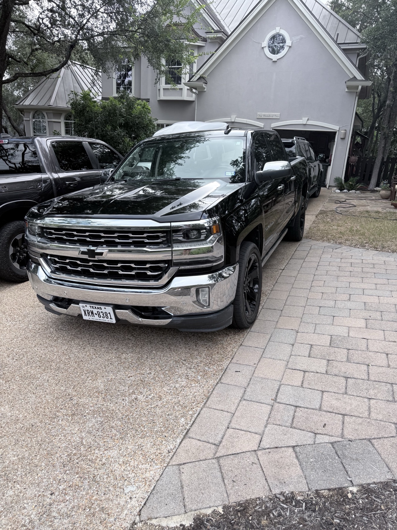 Black Chevrolet Silverado front after premium exterior detail