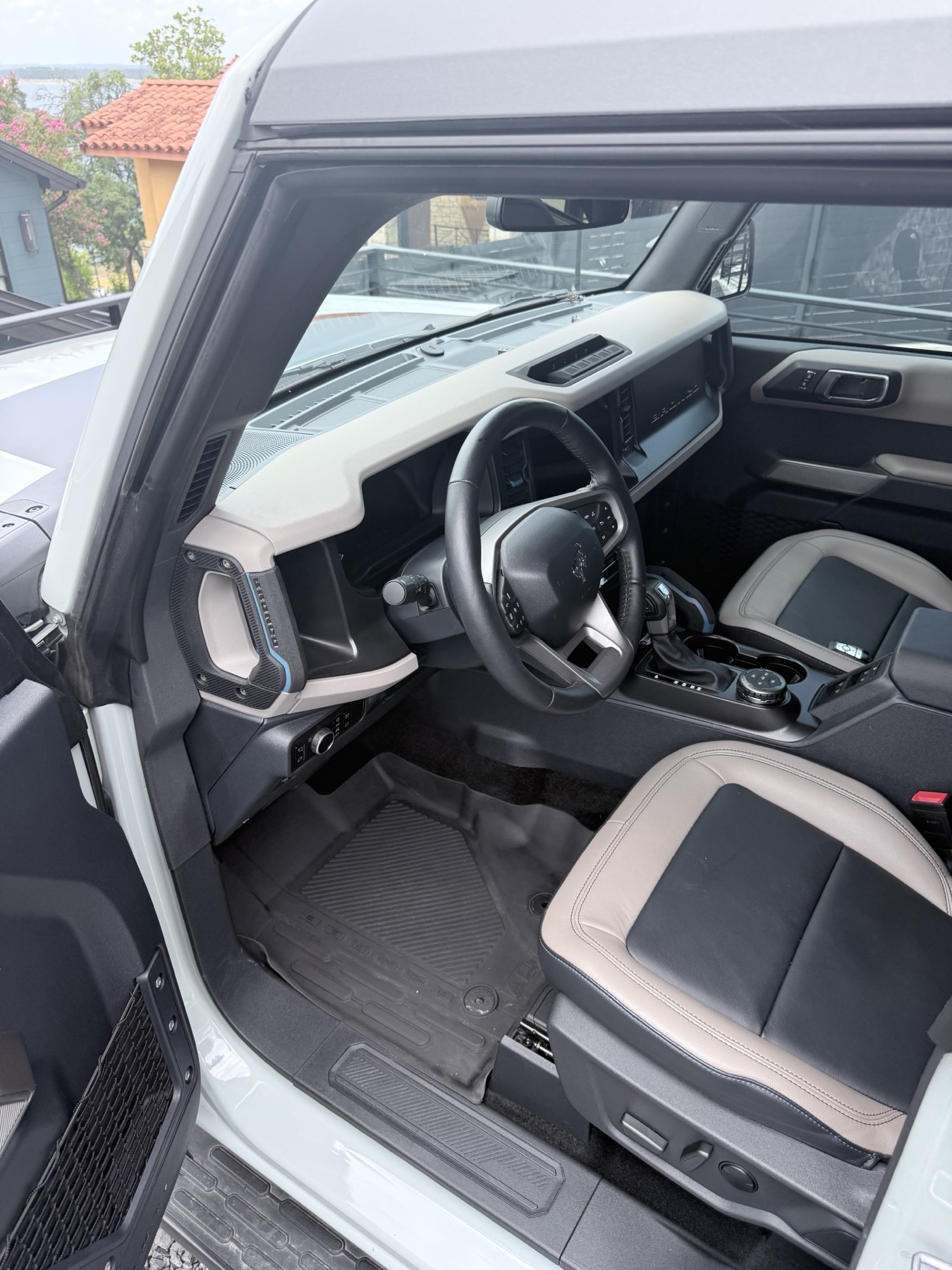 Clean Ford Bronco driver area and front seating photographed by Spade Detail Co.
