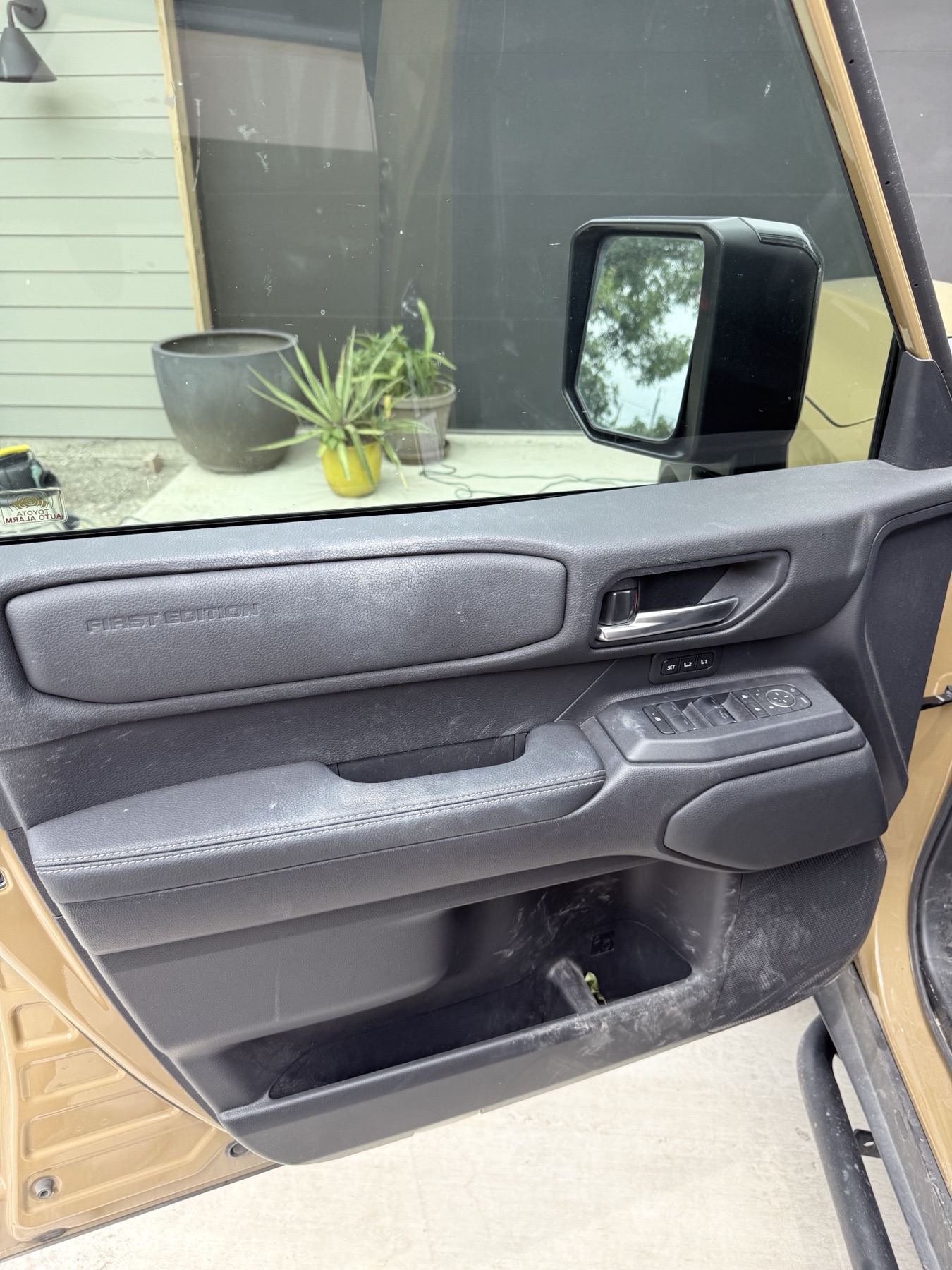 Toyota Land Cruiser driver door panel before interior detailing