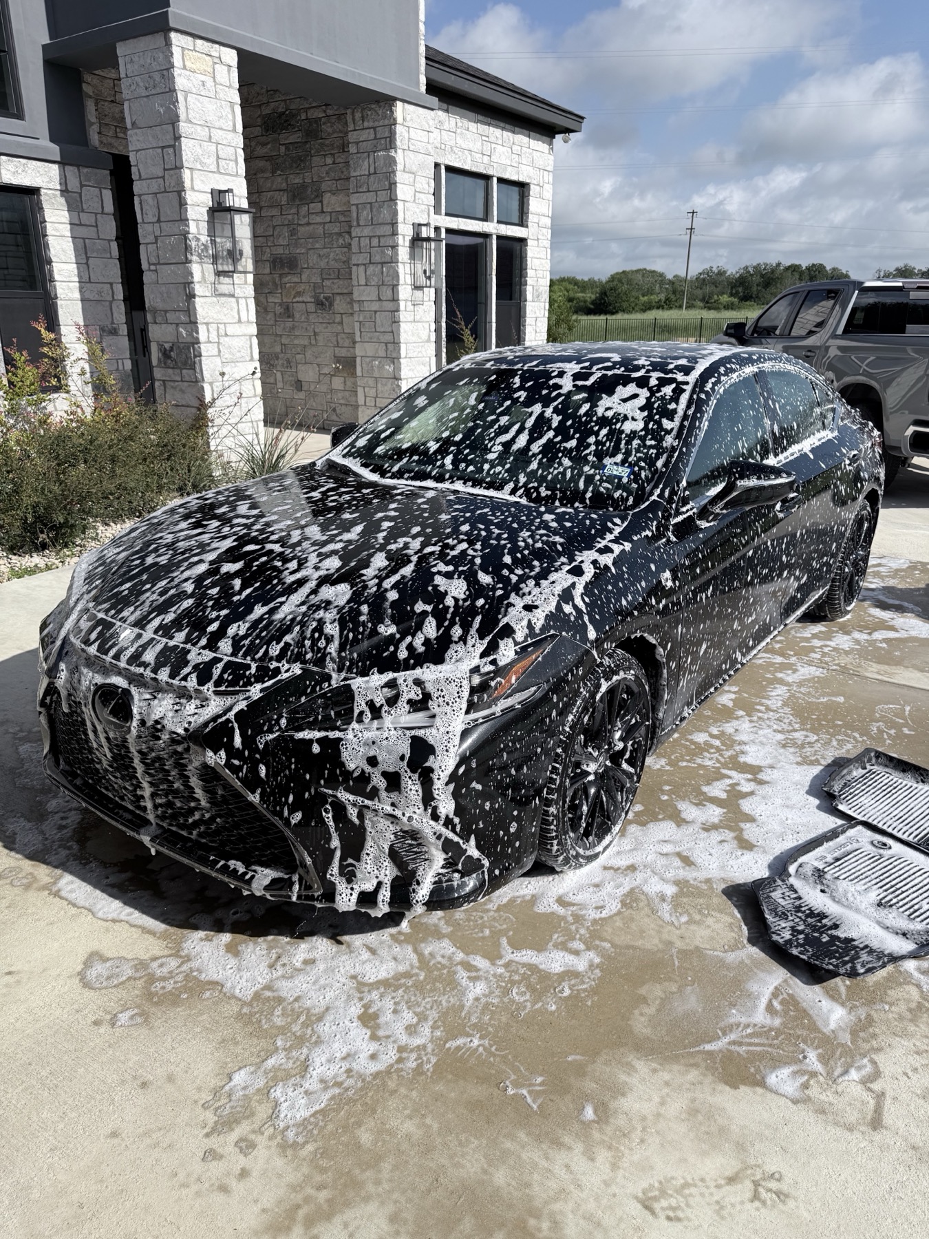 Black Lexus ES during foam wash process