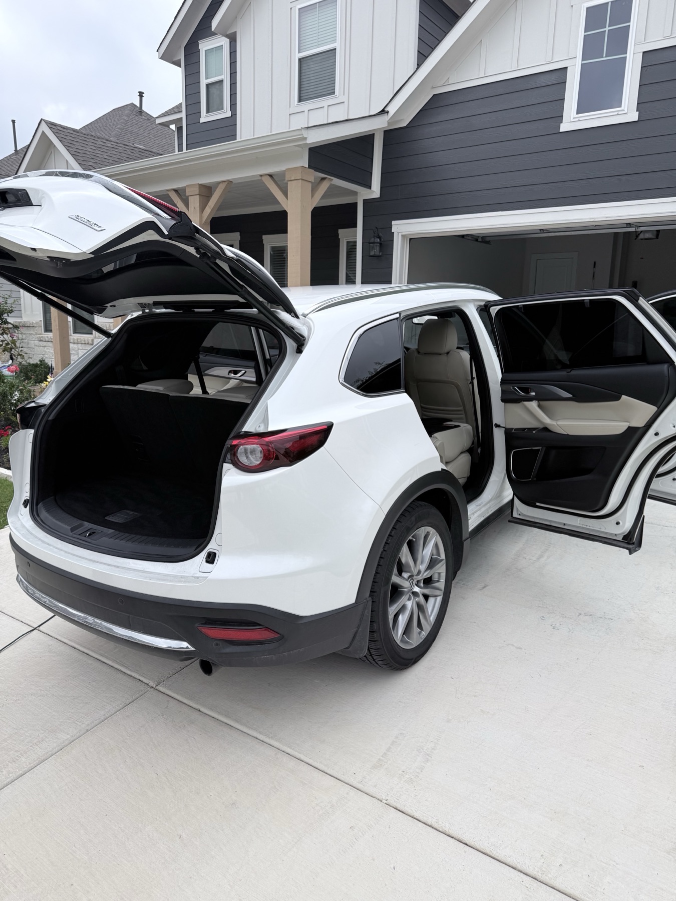 White Mazda CX-9 receiving mobile interior detailing at a Central Texas home