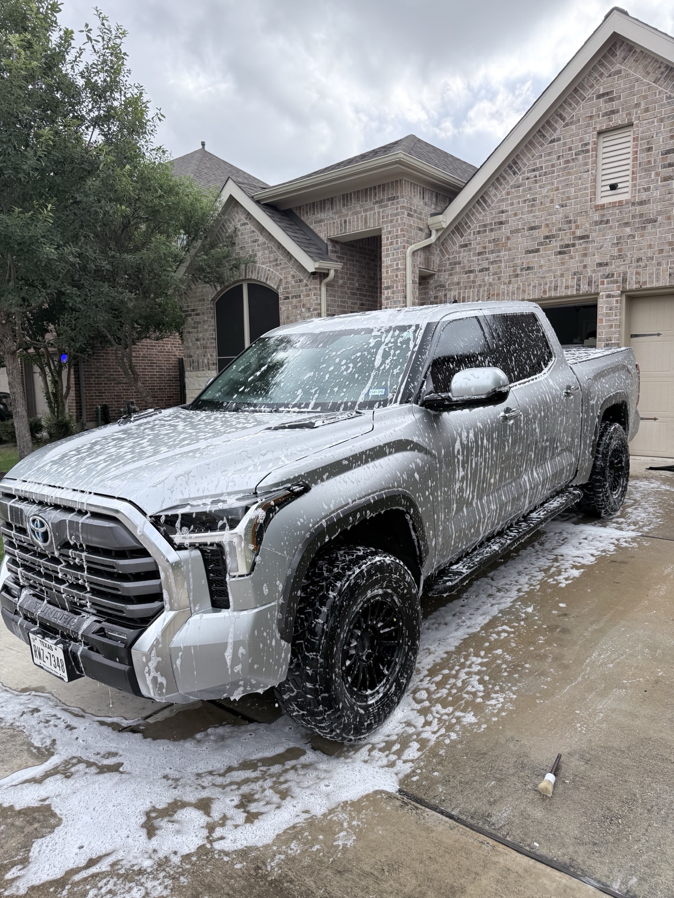 Toyota Tundra covered in foam during mobile detailing wash process