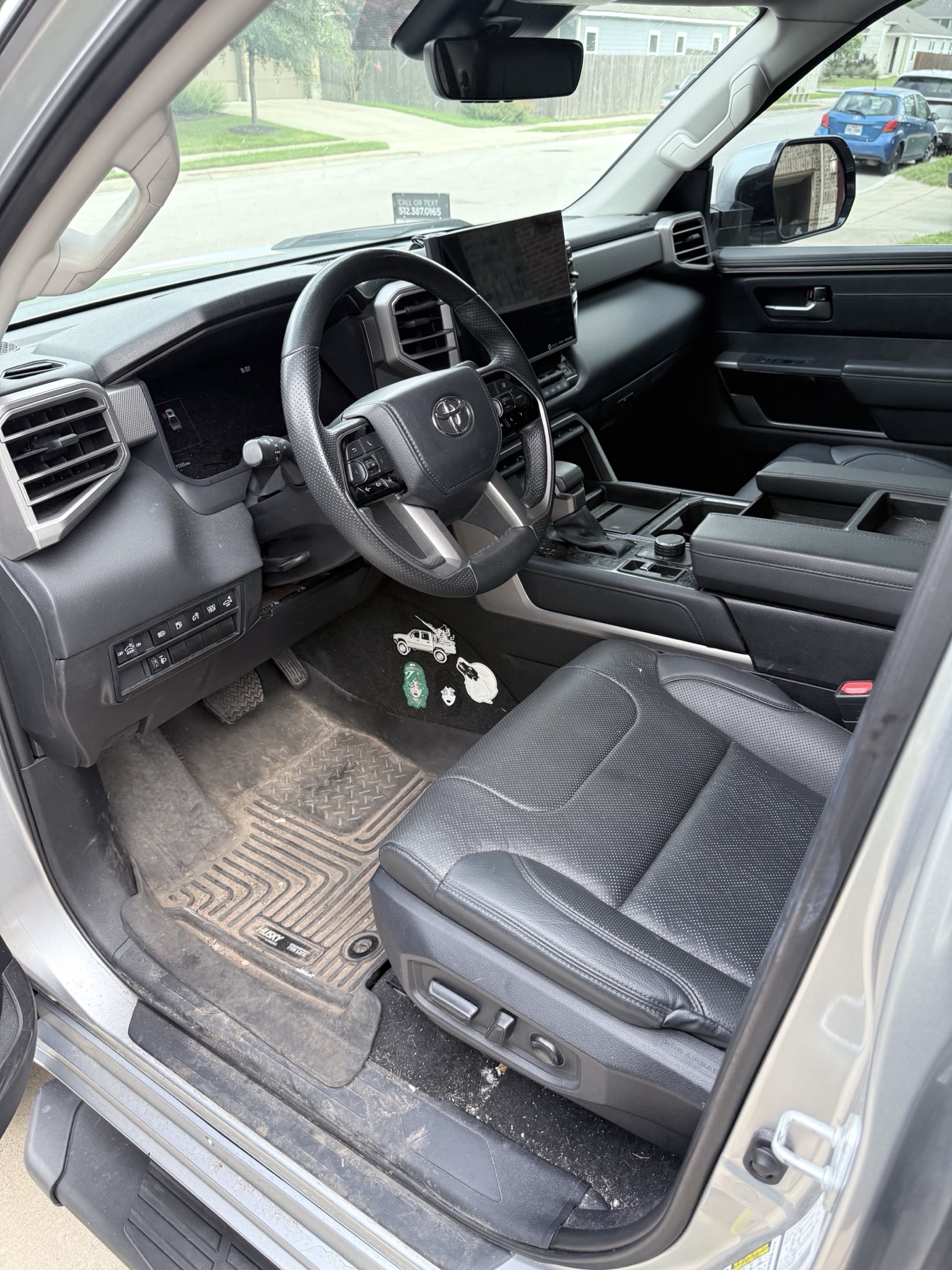 Toyota Tundra interior before premium mobile detailing with dirty floor mats and cabin buildup